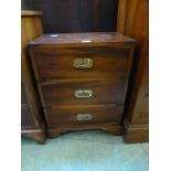 A modern walnut and brass mounted three drawer bedside chest