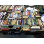 Four trays of hardback books by various authors