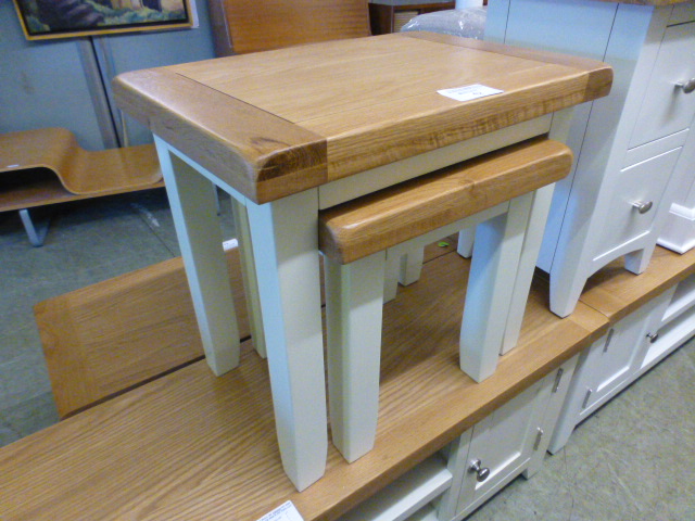 A nest of two oak topped occasional tables (13.