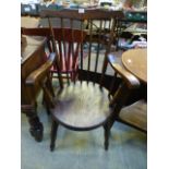 A beech and elm spindle back open arm chair