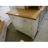 An oak topped side cabinet with single drawer over two cupboard doors (40.