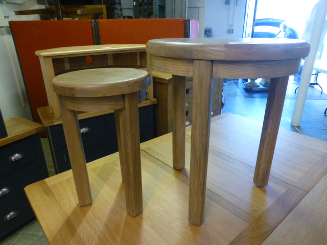 Two circular oak occasional tables (20.