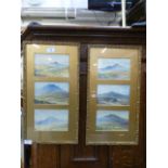 Six watercolours of hill scenes set in two framed displays