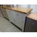 An oak topped two drawer over two door cabinet (19.