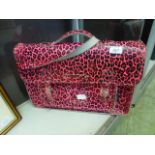 A pink printed leather Anna Wells satchel
