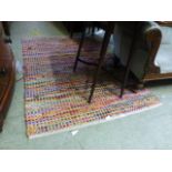 A modern multi coloured wool rug