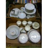 Two trays of ceramic tableware to include cups, saucers, plates etc.