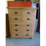 An oak chest of two short over two short and three long drawers (11.