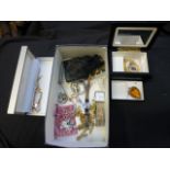 A carton of assorted costume jewellery to include necklaces, watches etc.