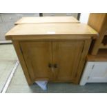 An oak two door cabinet (24.