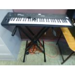 A Yamaha SY22 keyboard on stand