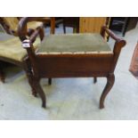 An early 20th century oak and pine music stool