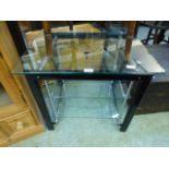 A modern glass and metal multi level table