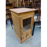 A modern pine glazed cabinet,