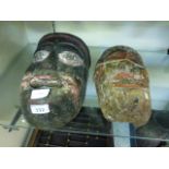 Two Himalayan carved wooden masks