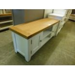 An oak topped white based low level media cabinet (38.