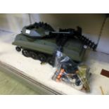 An Action man tank together with an assortment of accessories