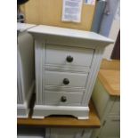 A white three drawer bedside chest (6.