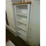 An oak topped and ivory open bookcase (39.