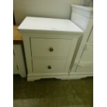 A white two drawer bedside chest (7.