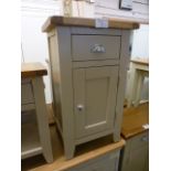 An oak topped grey based bedside cabinet (8.