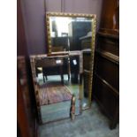 A gilt framed rectangular beveled glass mirror along with one other (a/f)