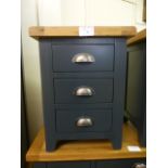 An oak topped and dark grey based three drawer bedside cabinet (16.