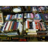 Four trays of hardback books on various subjects