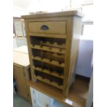 An oak wine rack with single drawer (29.