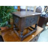 A 17th century style oak box stool with carved sides