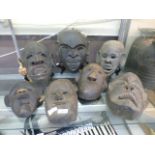 Seven African carved wooden masks