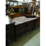 An Edwardian oak washstand with tulip tile splash back over red veined marble top