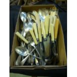 A box of assorted flatware