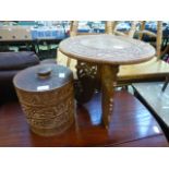 An Indian carved top table on collapsible base along with a cylindrical storage box