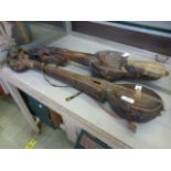 Two Himalayan wooden carved stringed instruments