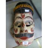 A Himalayan carved wooden painted mask