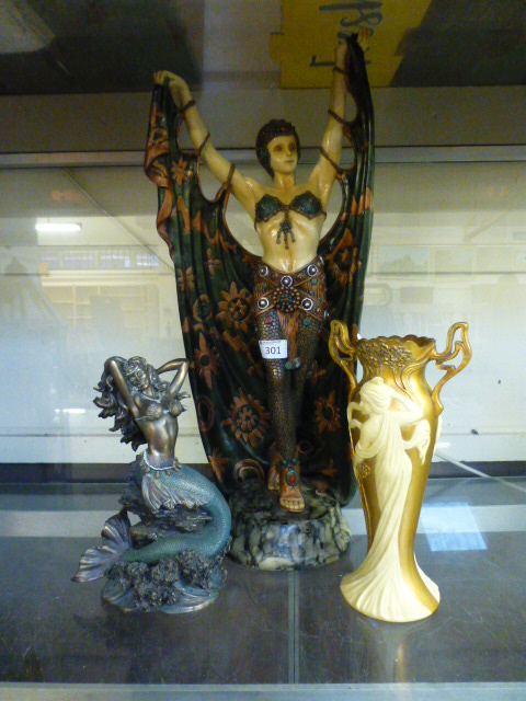 A modern Art Deco style figure of a lady together with a moulded model of a mermaid and a gilt