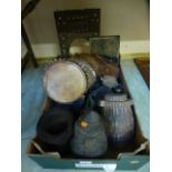 A tray of eastern wooden carved items together with a pair of brass binoculars