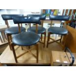 A set of four mid-20th century dining chairs