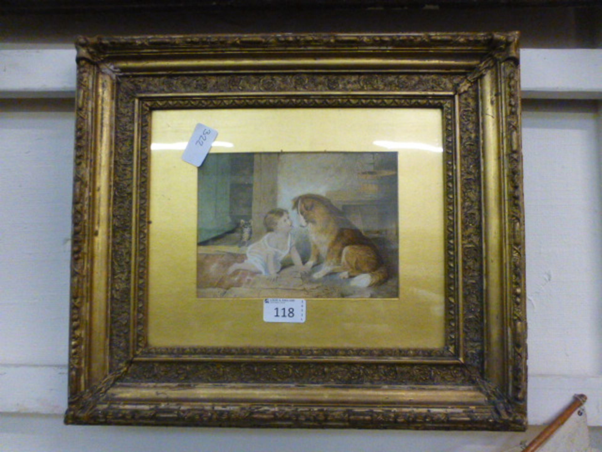 An ornate gilt framed and glazed print of child with a dog and cat,