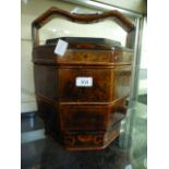 A Chinese lacquered wooden three tier wedding basket