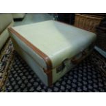 A mid 20th century fibre and leather banded suitcase