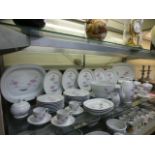 A large quantity of Coquet Limoges tableware comprising of plates, tureens, teapot, coffee cans,