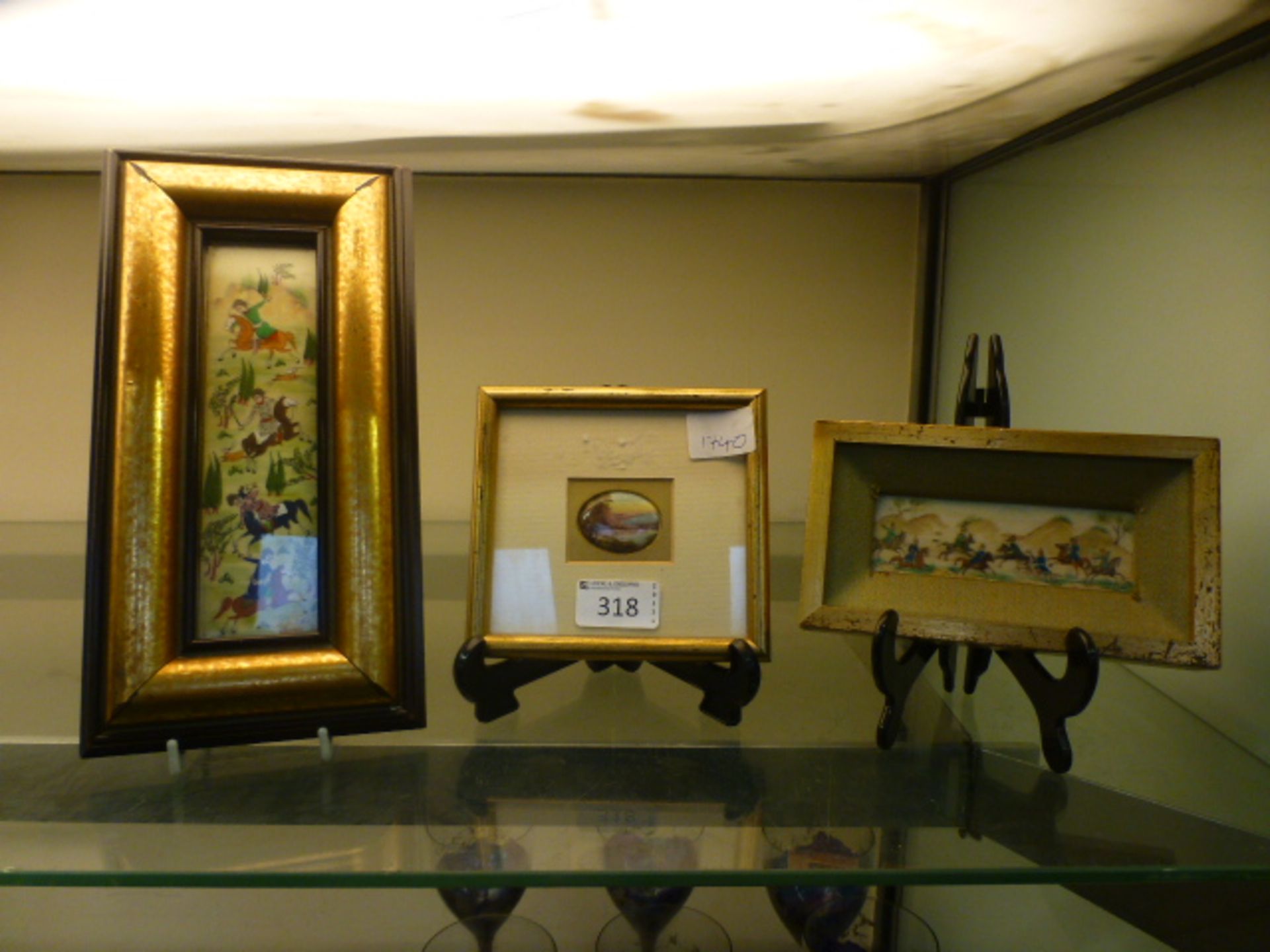 A small framed oil on porcelain of country scene together with with two framed oriental oils