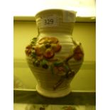 A Clarice Cliff floral decorated vase,