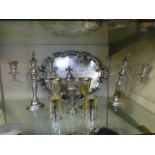 A selection of plated ware to include a twin handled tray, pair of candelabra, goblets etc.