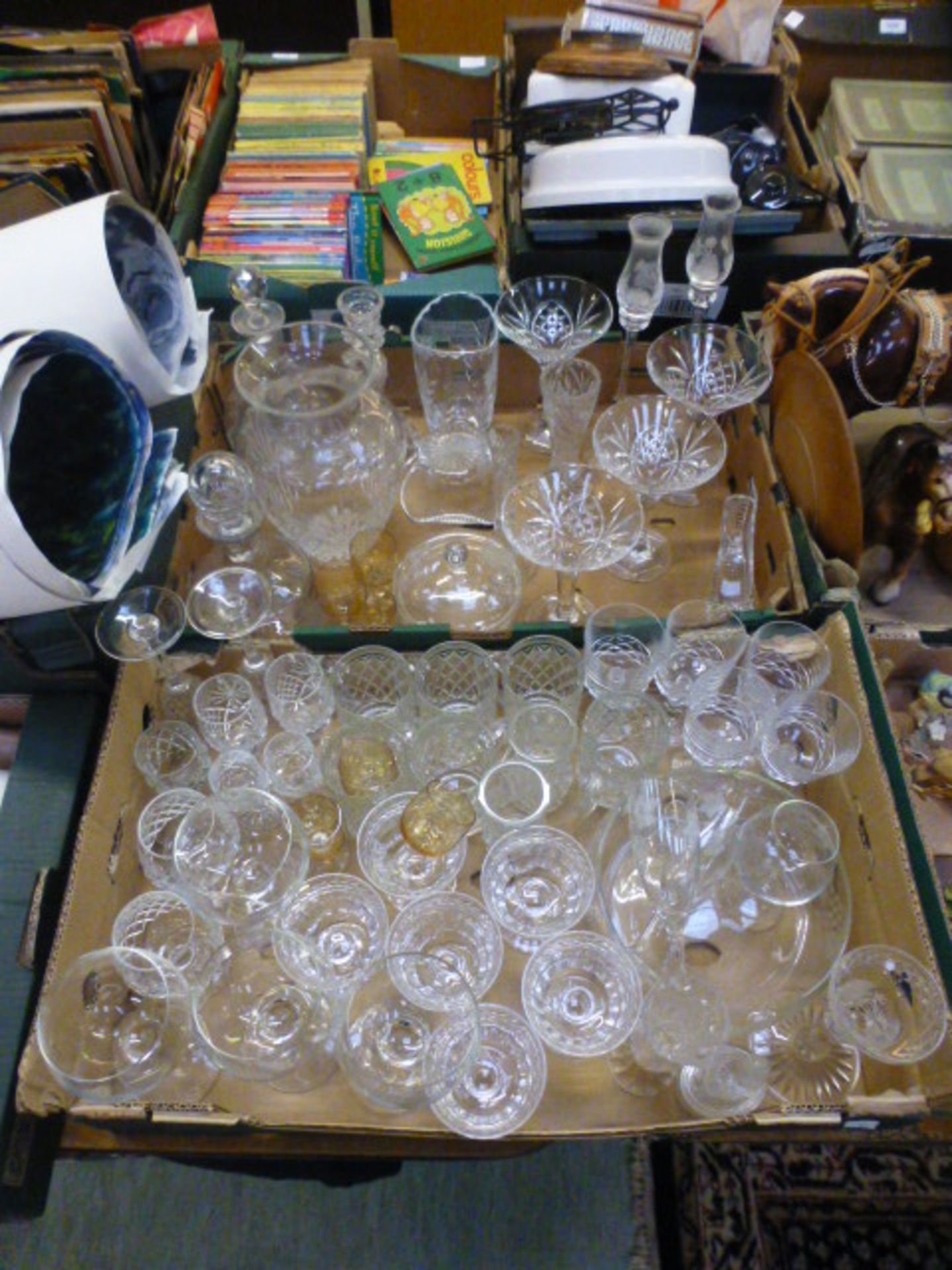 Two trays of cut and pressed glassware to include vases, drinking vessels, bowls etc.