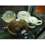 A selection of Wedgwood Beatrix Potter plates and bowls together with an assortment of Wade