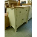 An oak topped side cabinet single drawer over two cupboard doors (37.