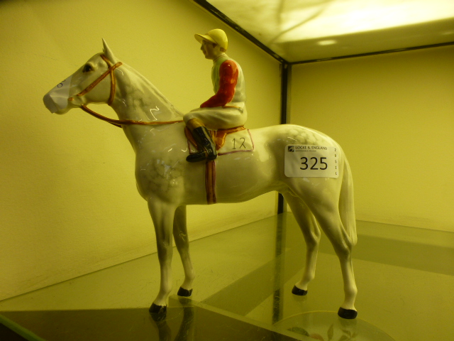 A Beswick jockey on grey horse CONDITION REPORT: No apparent damage